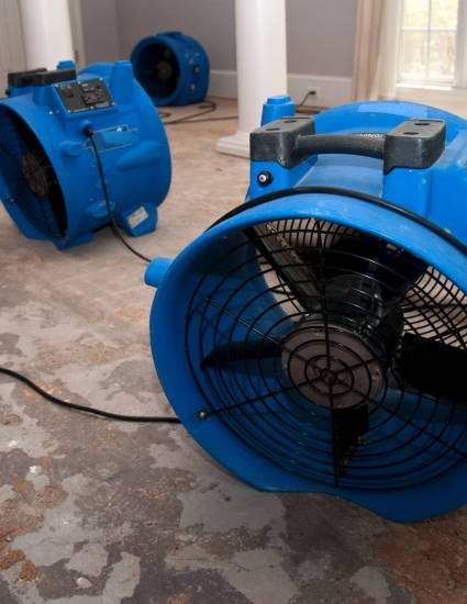 sewage flood home restoration This is the sewage water damage recovery process in a residential home. The flooring is ripped off, and the rooms are sprayed with biowash. Industrial fans and dehumidifiers is placed in the room for the drying and restoration process. The process will last 3 days.